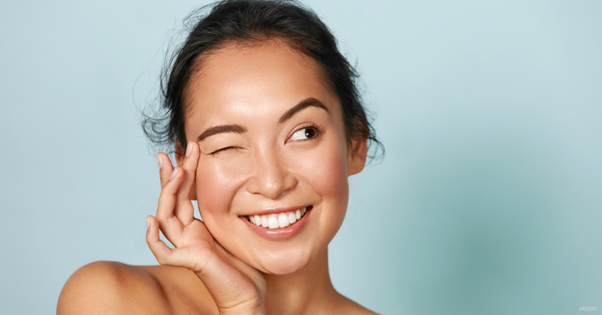 smiling woman after botox to prevent wrinkles