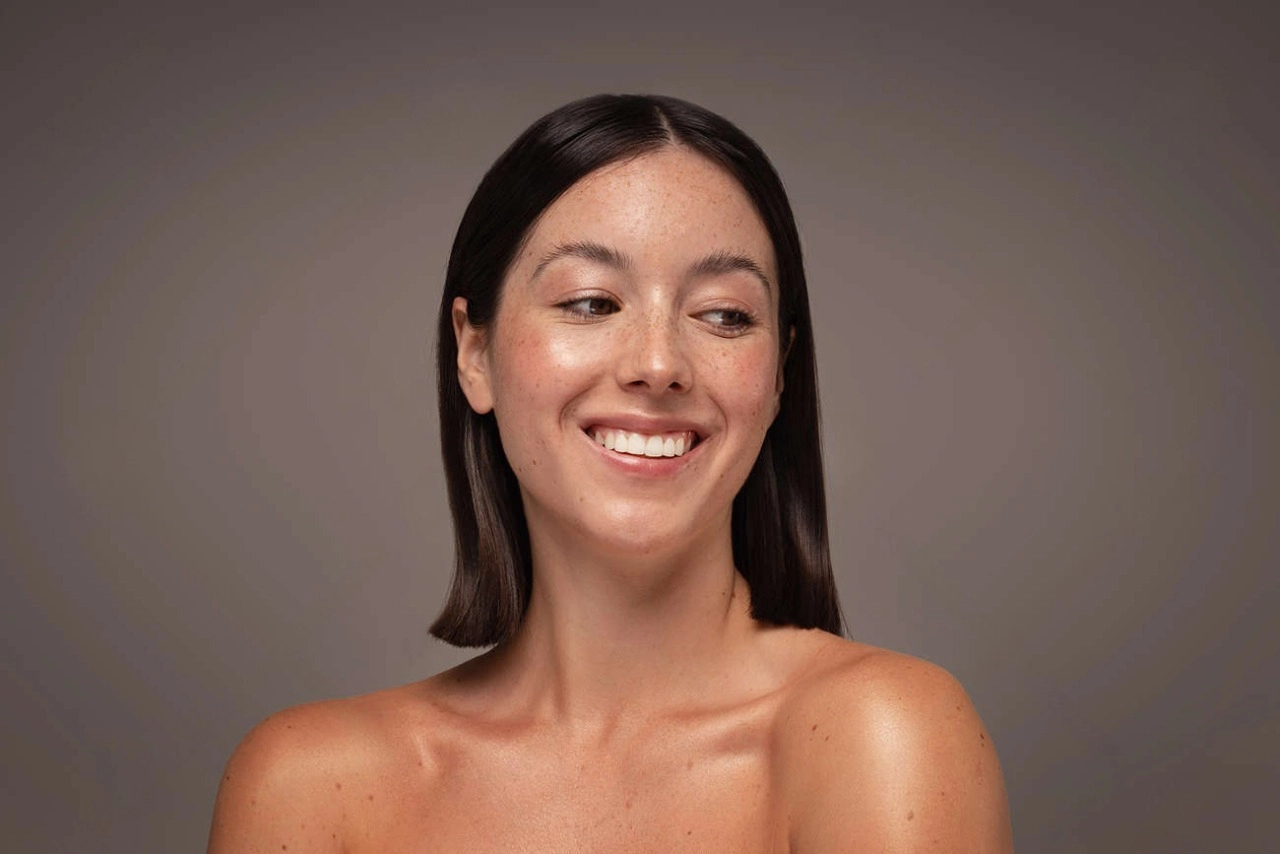 Happy client after chemical peel at Skincare Sommelier in Queens NYC