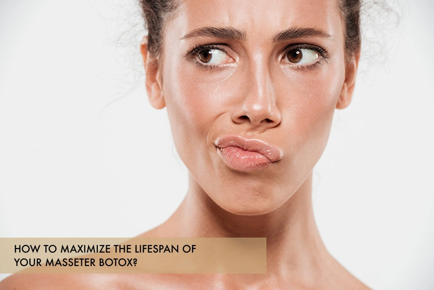 A woman highlighting jaw tension, used to illustrate how to maximize the lifespan of Masseter Botox results at Skincare Sommelier NYC.