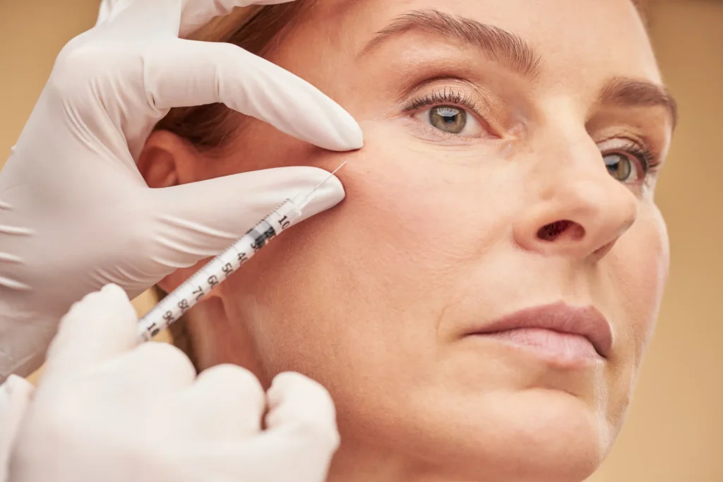 A woman with a refreshed and youthful appearance after a Liquid Facelift treatment at Skincare Sommelier Beauty Lab & Med Spa in NYC.