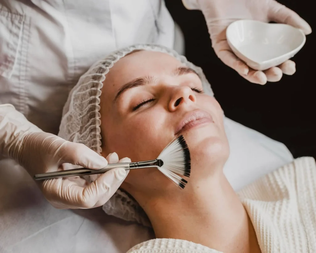 Professional application of a summer-safe chemical peel using a fan brush at Skincare Sommelier Beauty Lab & Med Spa.